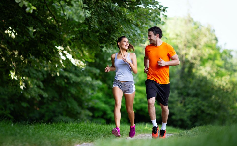 portrait of happy fit people running together ourdoors couple sport healthy lifetsyle concept