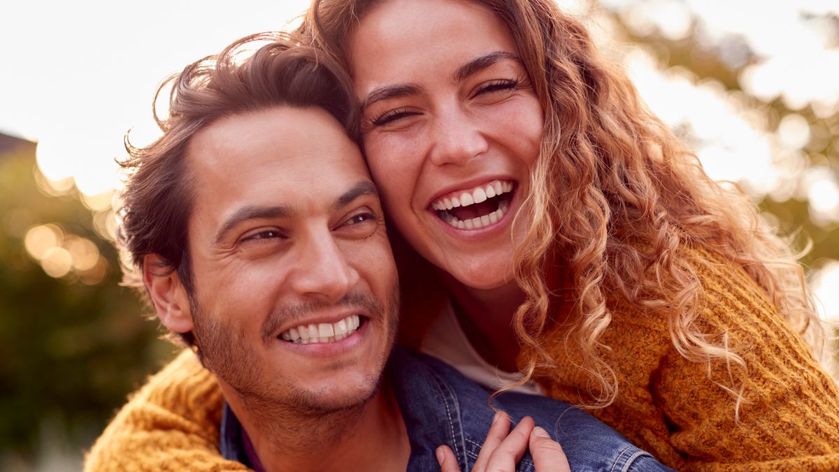https://hips.hearstapps.com/hmg-prod/images/portrait-of-happy-loving-couple-with-man-giving-royalty-free-image-1675702481.jpg?crop=1xw:0.84415xh;center,top&resize=1200:*