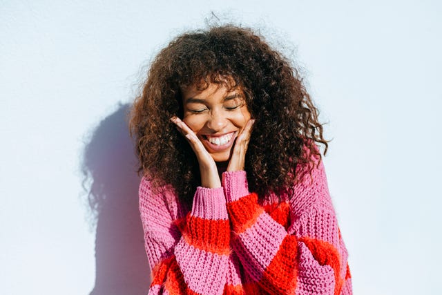 https://hips.hearstapps.com/hmg-prod/images/portrait-of-laughing-young-woman-with-curly-hair-royalty-free-image-1611599525.?crop=0.620xw:0.928xh;0.191xw,0.0719xh&resize=640:*