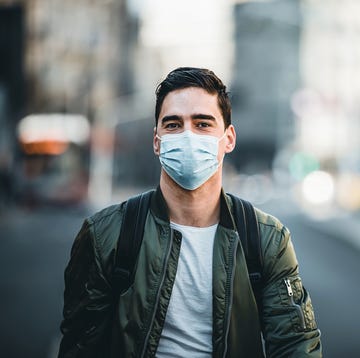 Portrait Of Man With Mask On The Street. portrait of man with mask on the street