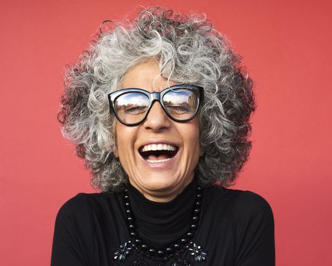 how to look younger portrait of mature woman laughing