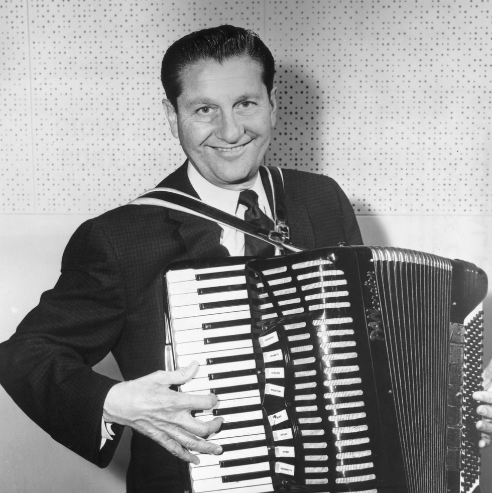 1957: portrait of popular american bandleader lawrence welk holding an accordion and smiling. (photo by hulton archive/getty images)