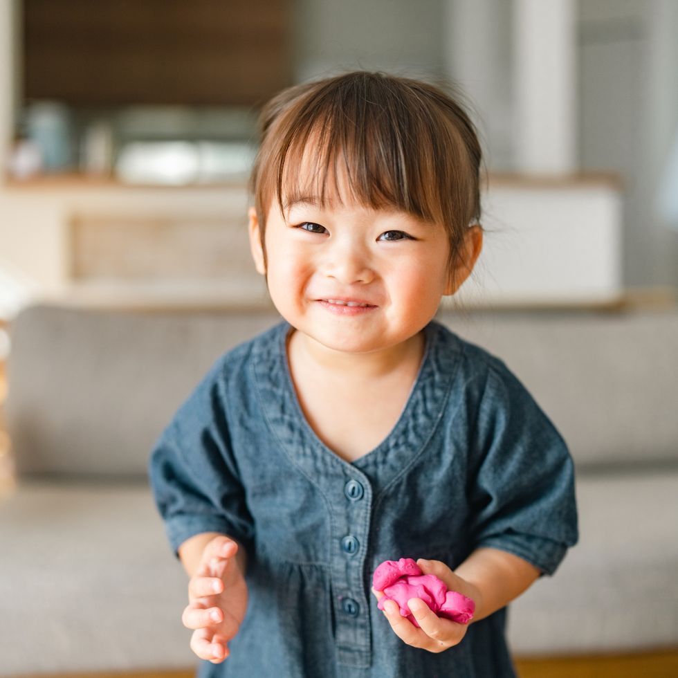 portrait of small girl in living room at home
