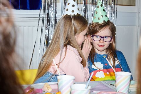 portrait of two girls having fun at a party
