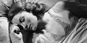 portrait of woman in bed sleeping