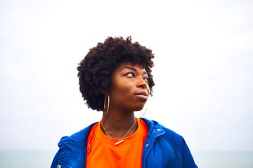 portrait of woman looking off camera with colourful clothing