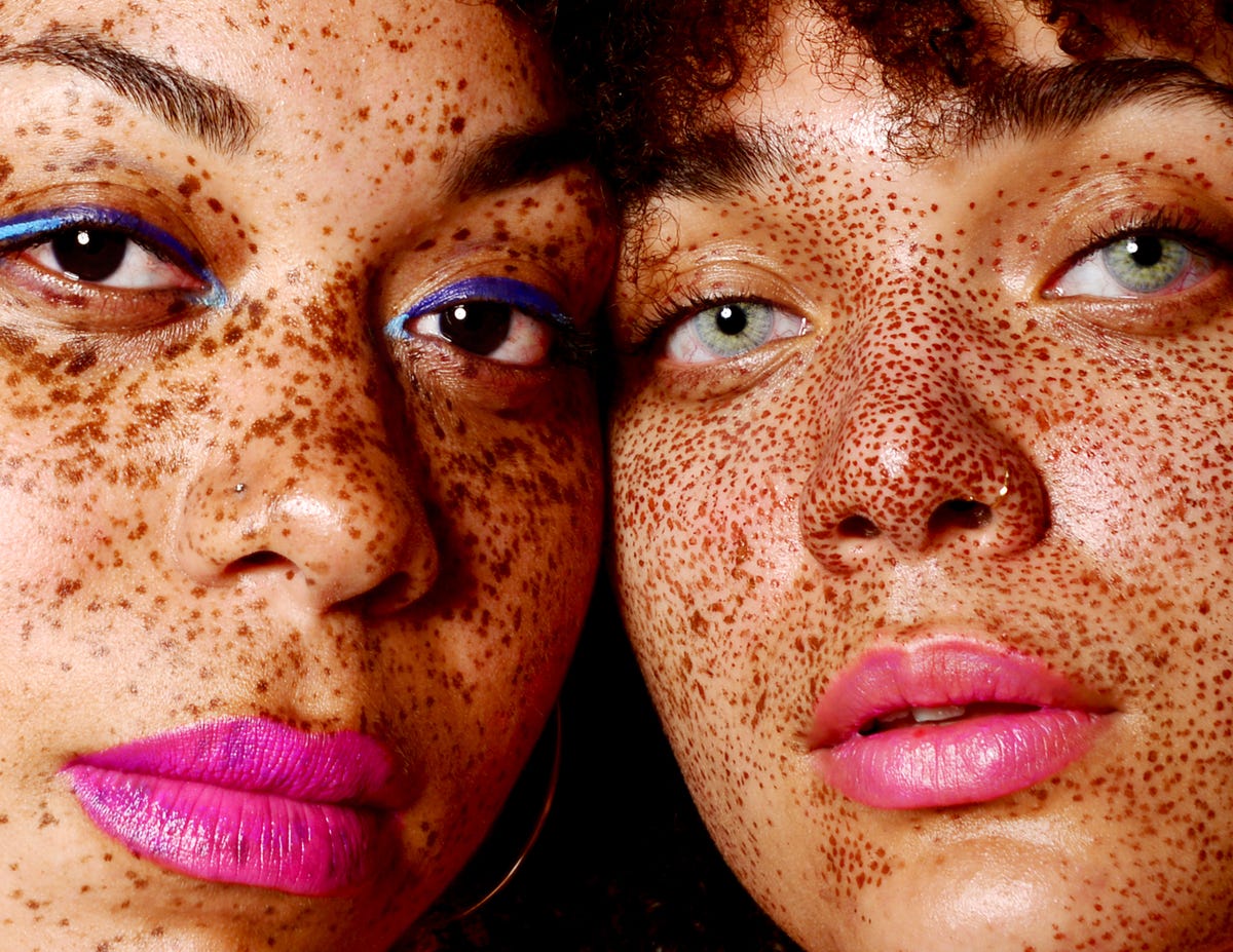 portrait of young confident women with freckles royalty free image