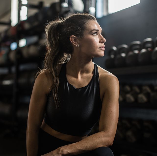 portrait of young woman in cross training gym