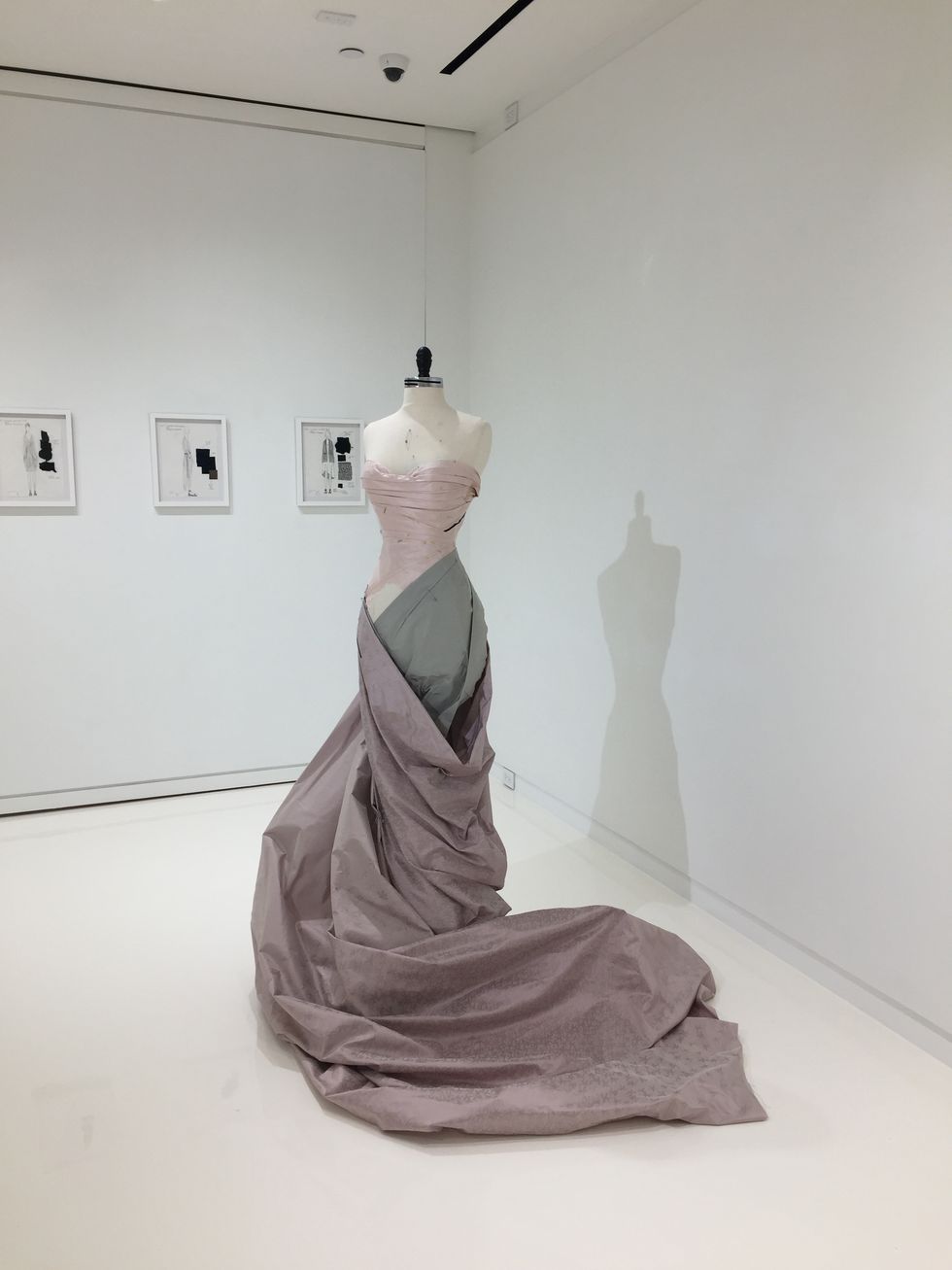 Dress, Sculpture, Fashion, Art, Museum, Tourist attraction, Gown, Stock photography, Room, Ceramic, 