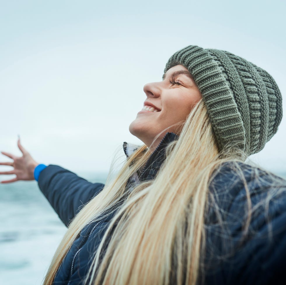Self-care ideas happy woman spreading arms with positive attitude
