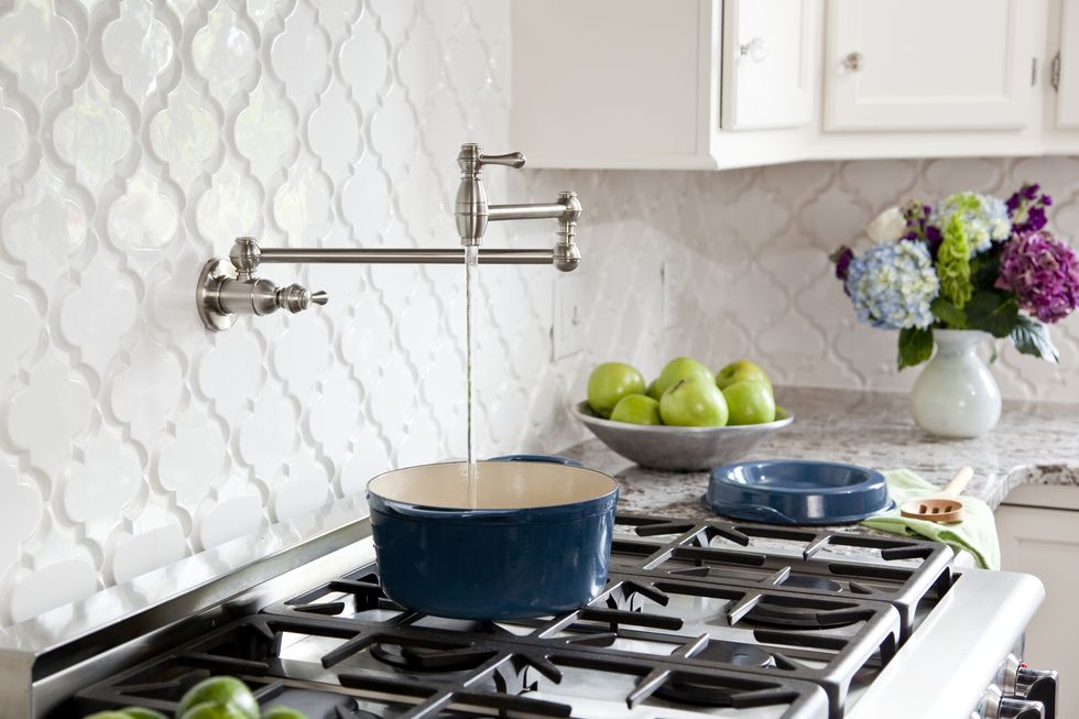 pot filler faucet on stove in kitchen