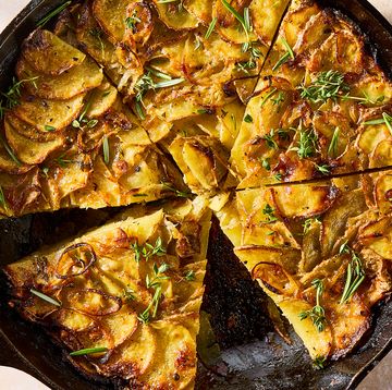 galette in a pan layered with thinly sliced potatoes