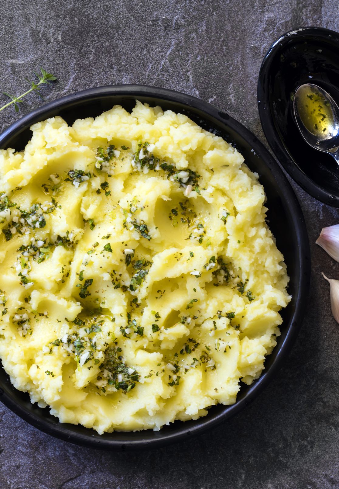 potato mash with olive oil garlic lemon and herbs top view