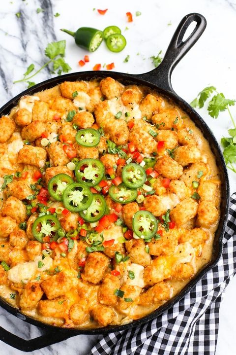 kicked up tater tot hotdish with jalapenos in cast iron skillet