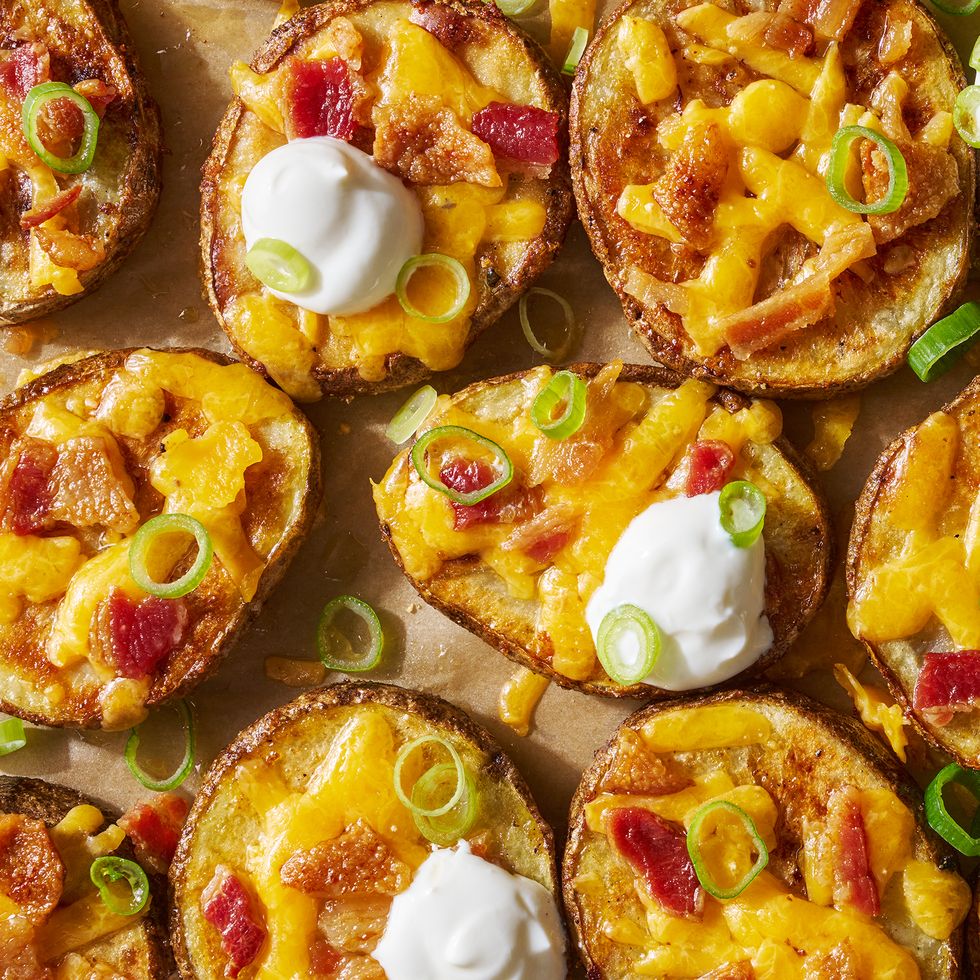 circles of crispy potatoes with melted cheese, bacon and dollops of sour cream