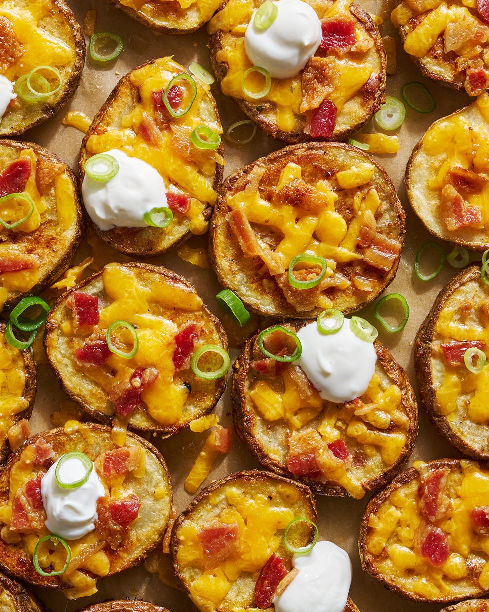 circles of crispy potatoes with melted cheese, bacon and dollops of sour cream