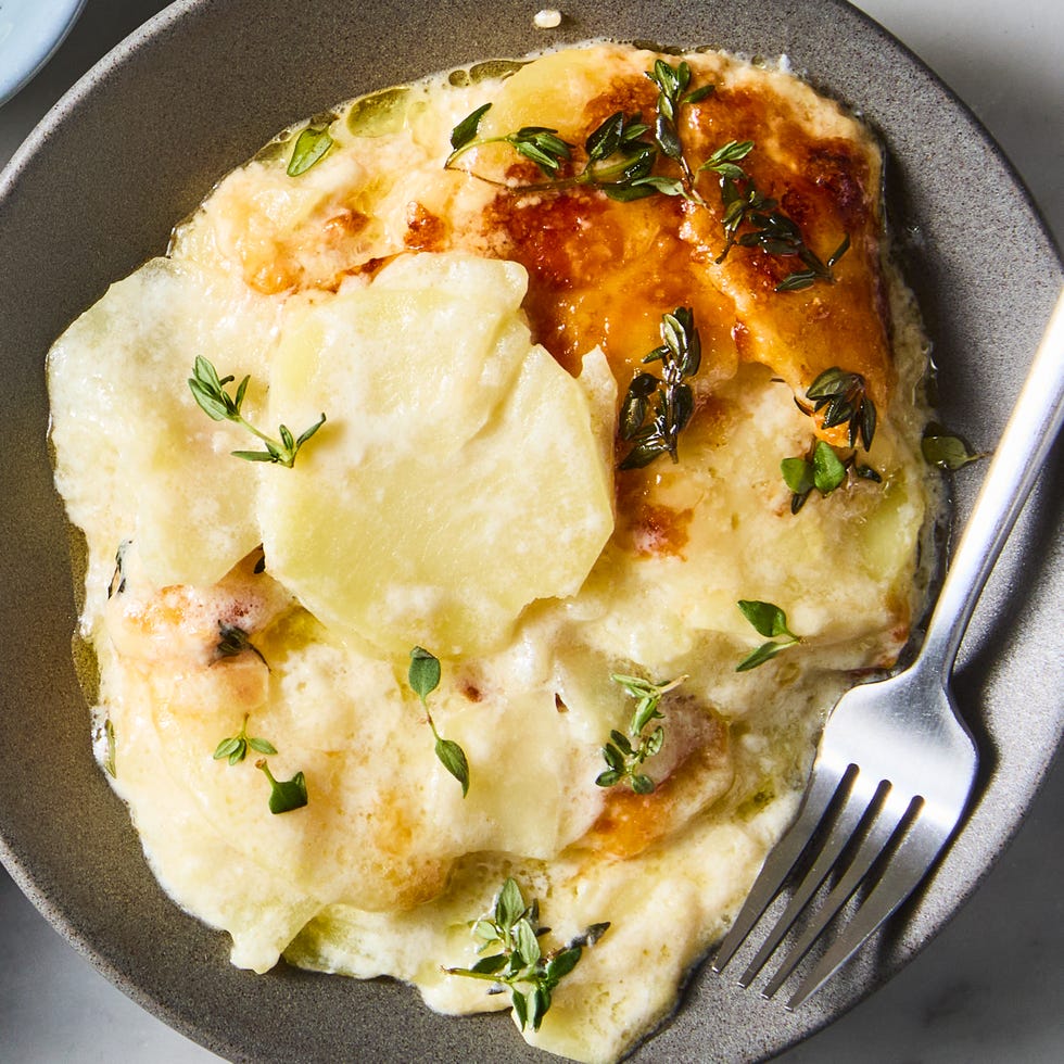 potatoes au gratin topped with thyme