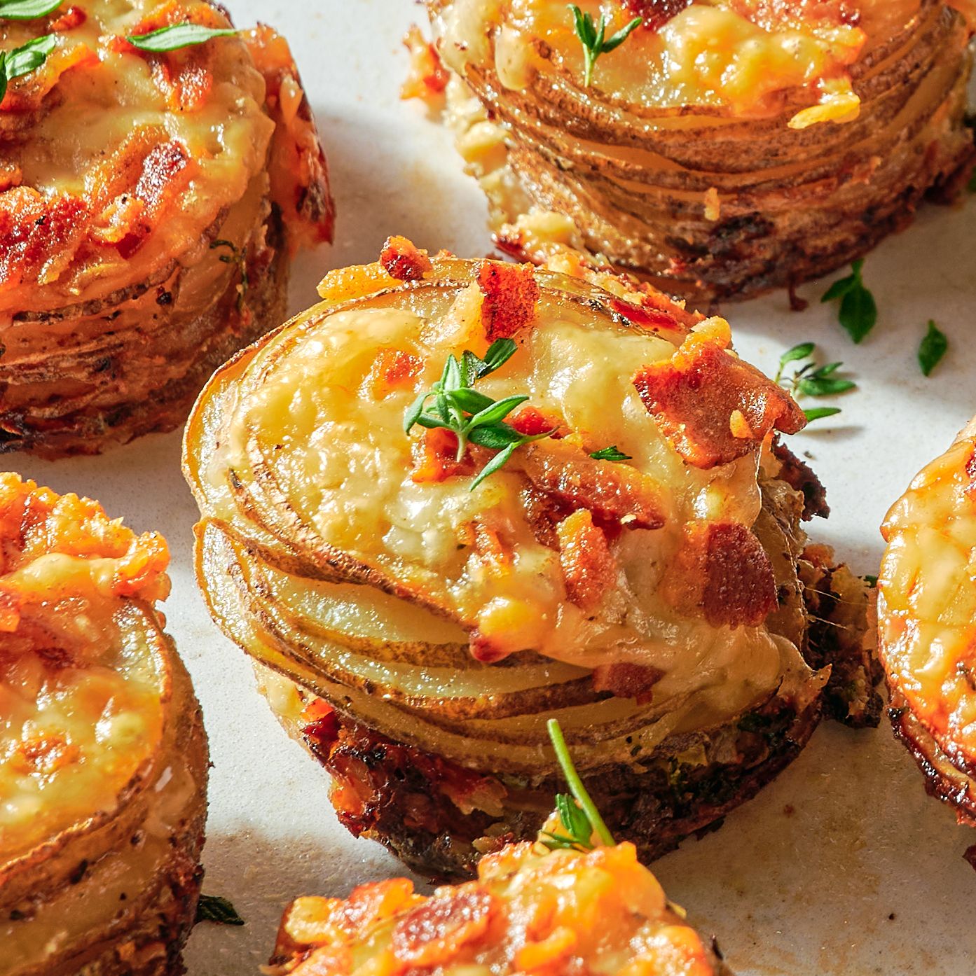 https://hips.hearstapps.com/hmg-prod/images/potatoes-au-gratin-stacks-lead-65119c76a6090.jpg