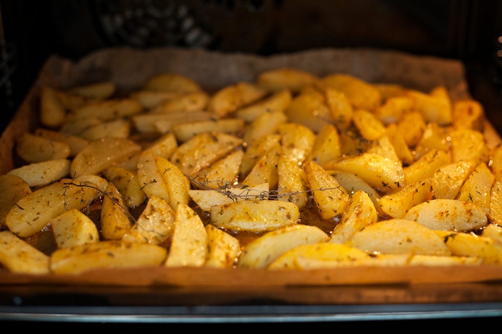 Potatoes with herbs roasting in the oven