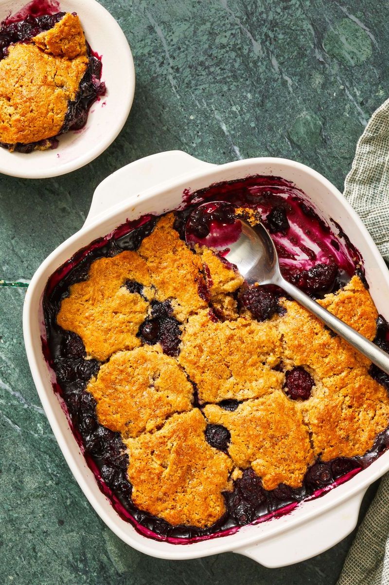 https://hips.hearstapps.com/hmg-prod/images/potluck-dishes-mixed-berry-cobbler-1677182604.jpeg?crop=0.6677777777777778xw:1xh;center,top&resize=980:*