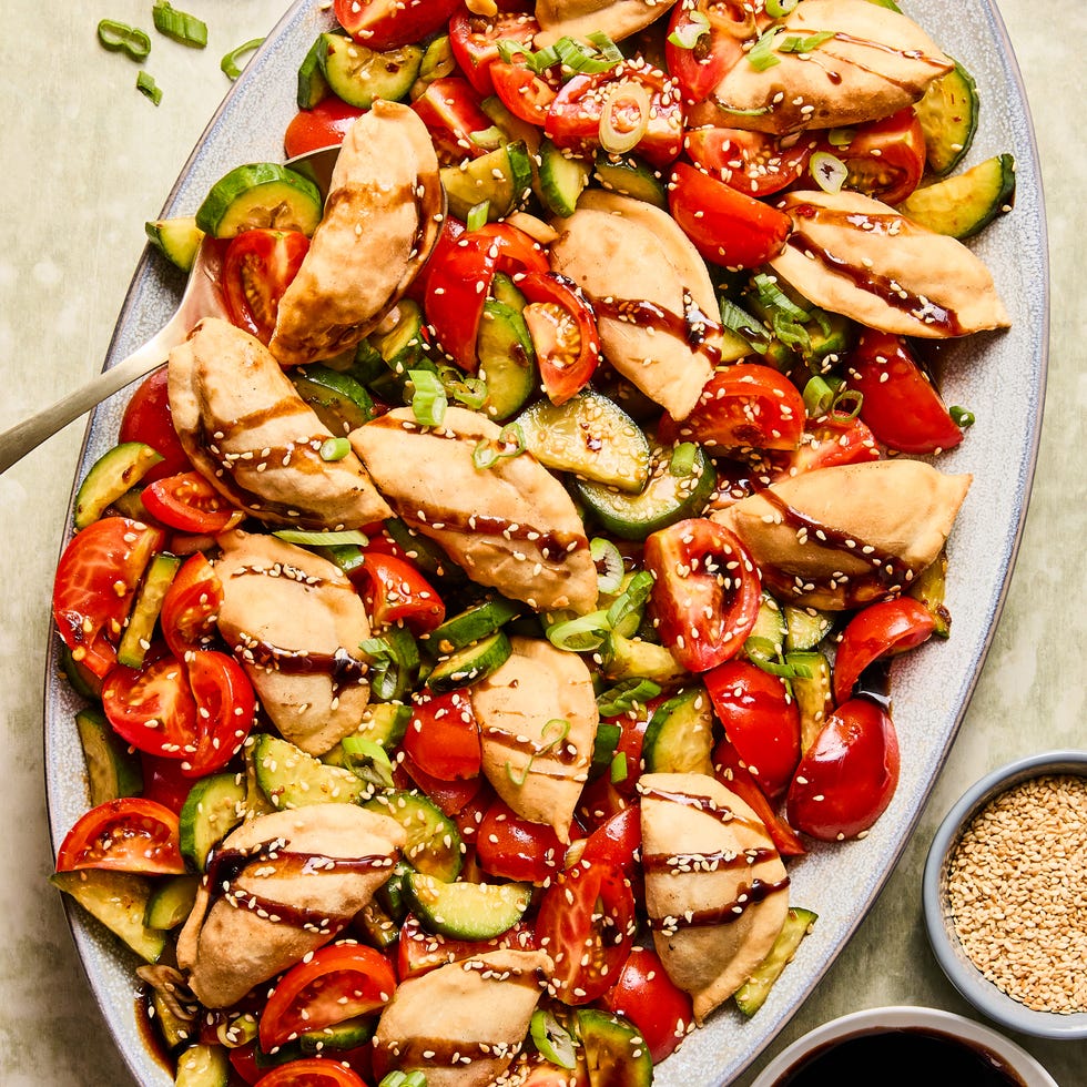 deep fried dumplings tossed with soy and chili marinated tomatoes and cucumbers