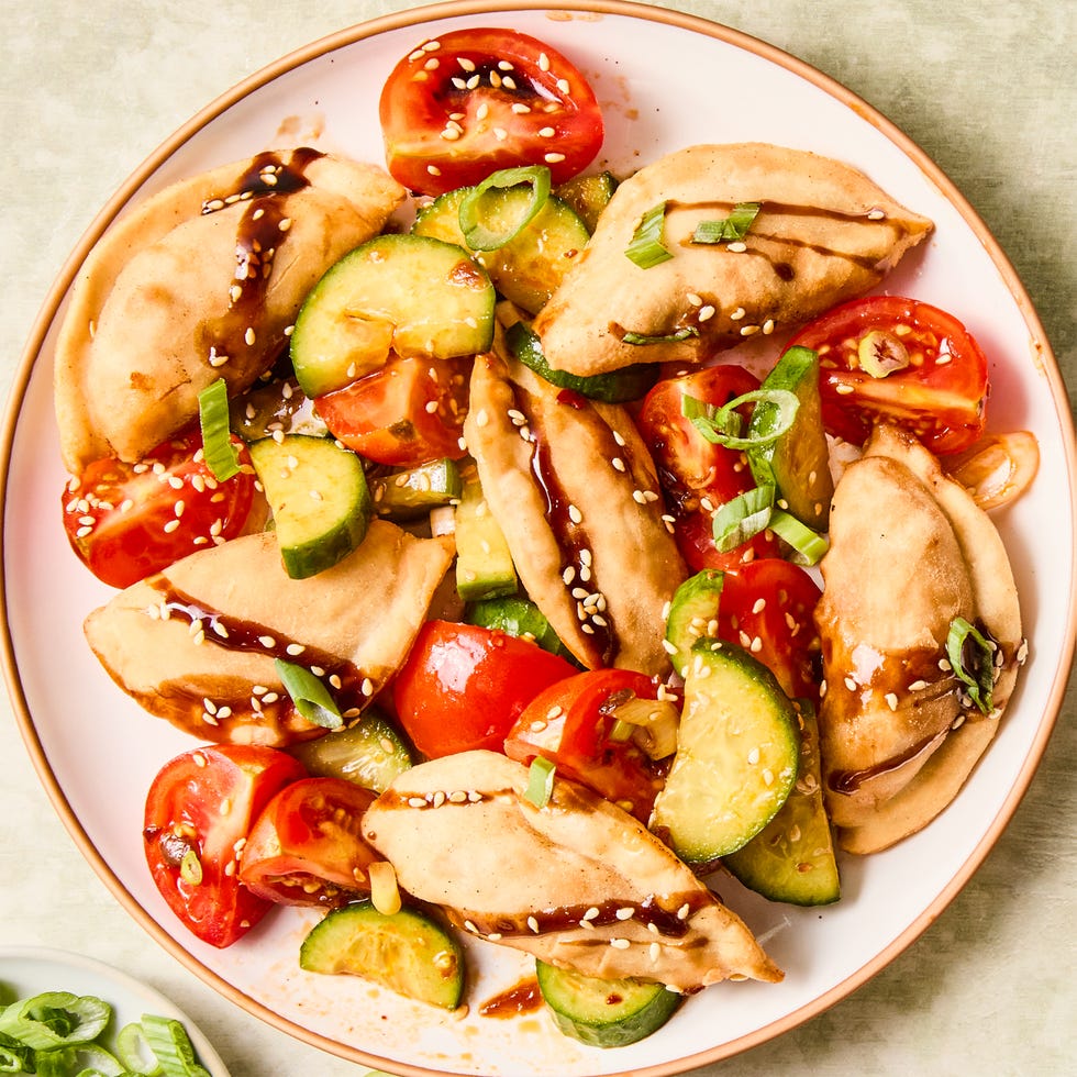 deep fried dumplings tossed with soy and chili marinated tomatoes and cucumbers