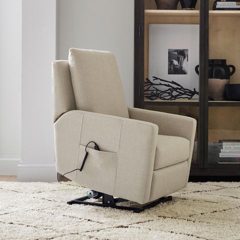 cream leather recliner chair leans forward to help with sitting and standing