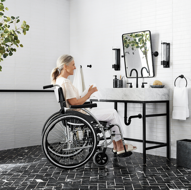 pottery barn accessible home collection, woman in wheelchair in bathroom