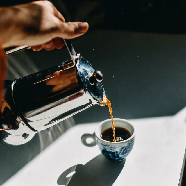 https://hips.hearstapps.com/hmg-prod/images/pouring-espresso-coffee-into-an-espresso-cup-with-a-royalty-free-image-1650053686.jpg?crop=0.668xw:1.00xh;0.0240xw,0&resize=640:*