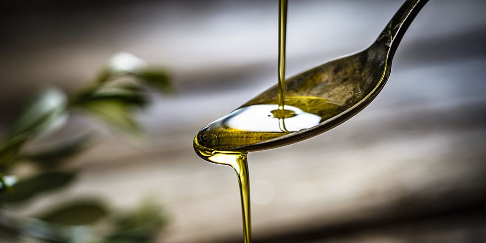 pouring extra virgin olive oil