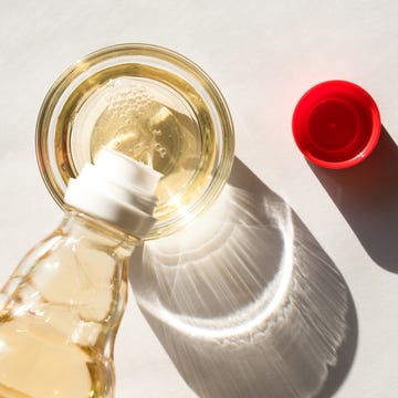 Pouring Rice Wine Vinegar in a Bowl pouring rice wine vinegar in a bowl