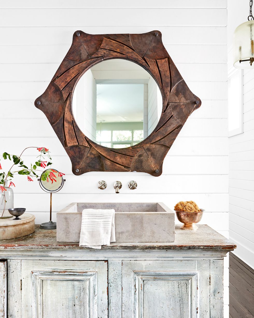 powder bathroom with an antique mirror