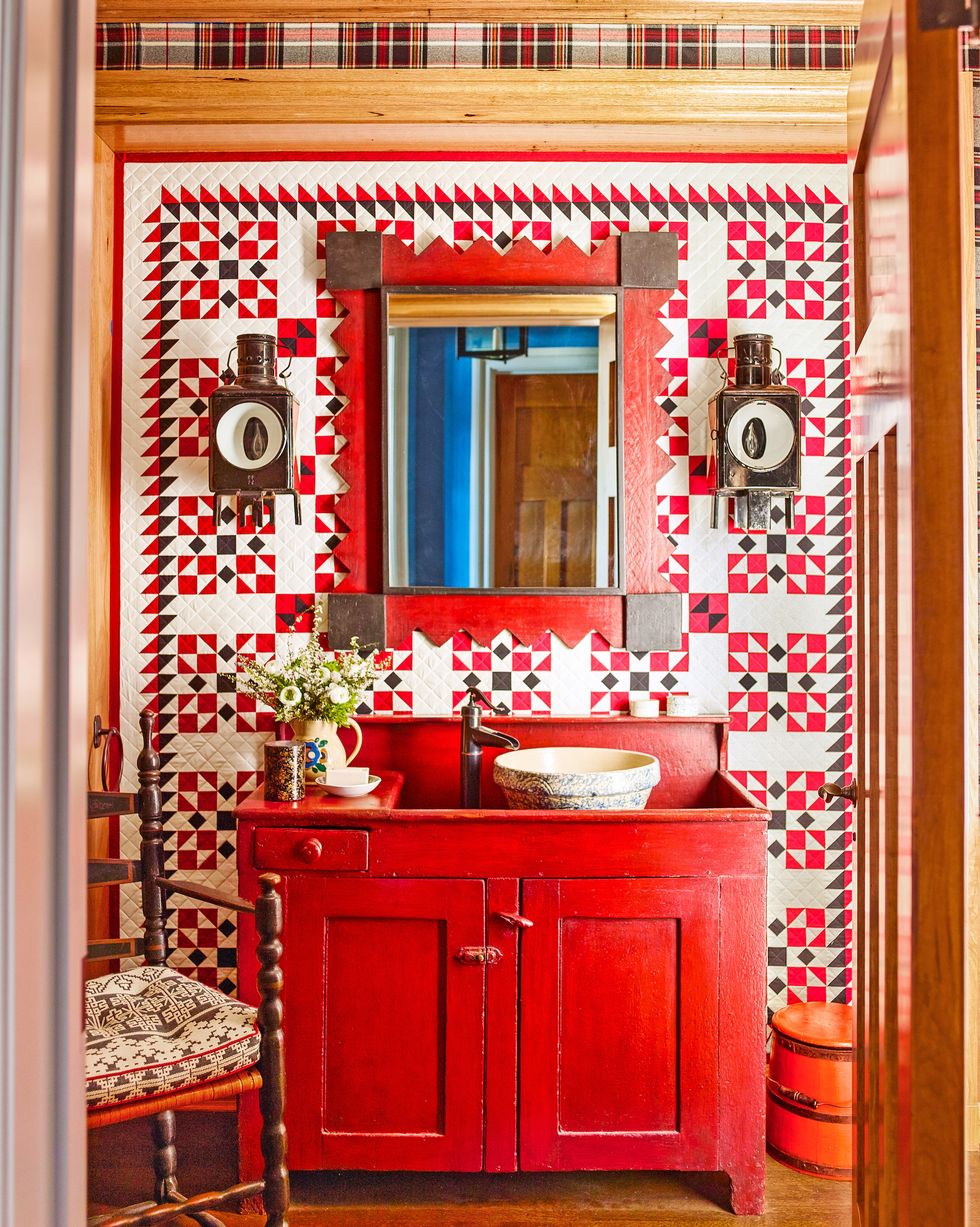 a bathroom with a red vanity