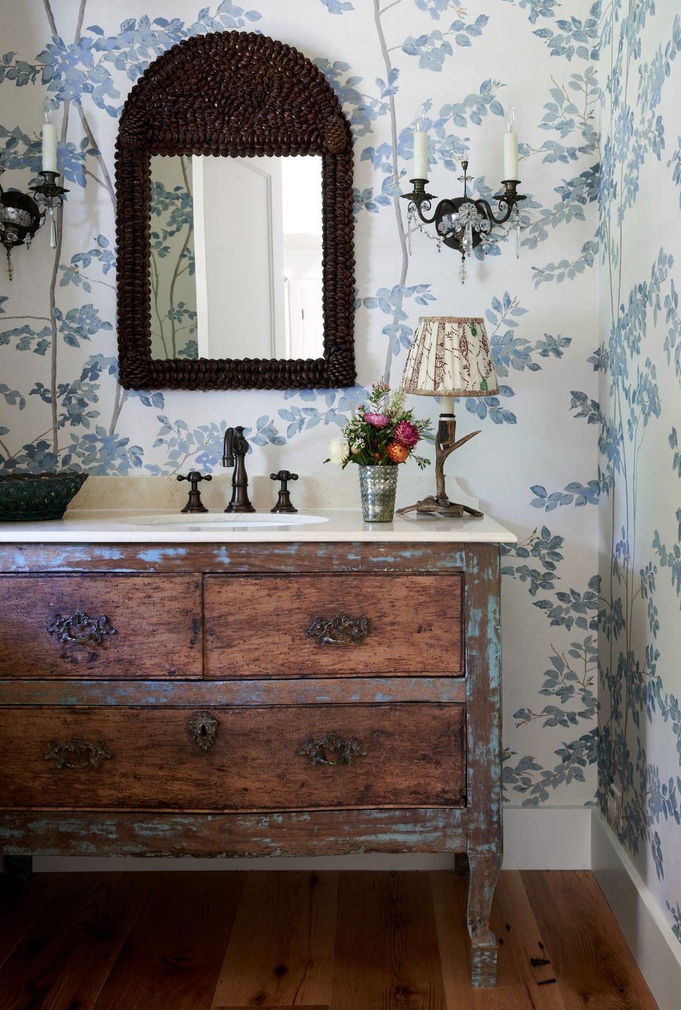 a bathroom with a chippy wood vanity