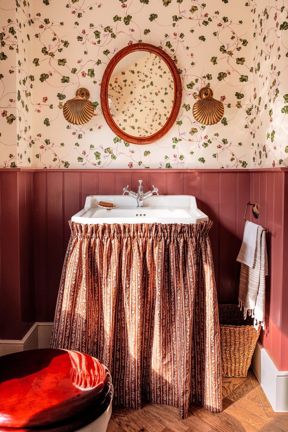 powder bathroom with botanical wallpaper and bead board