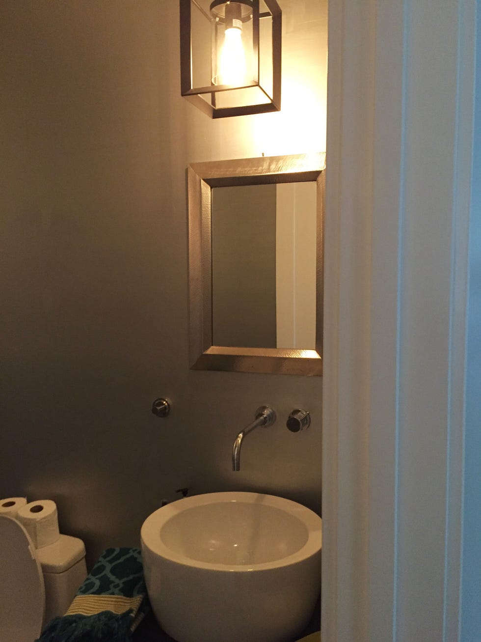 a bathroom with a mirror and sink