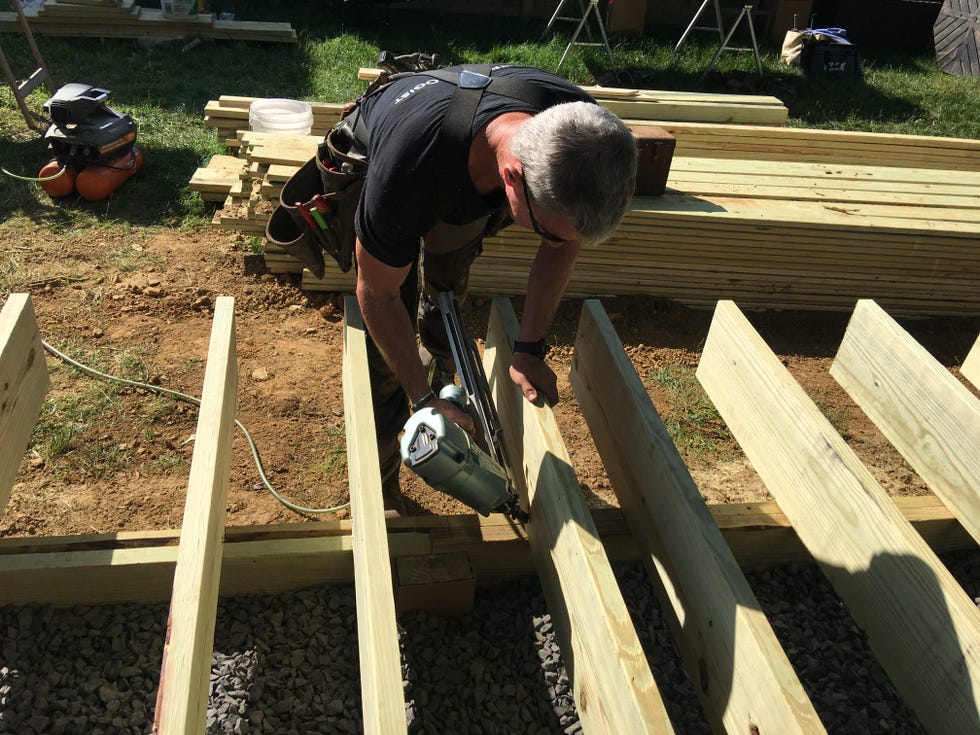 a person working on a wooden structure