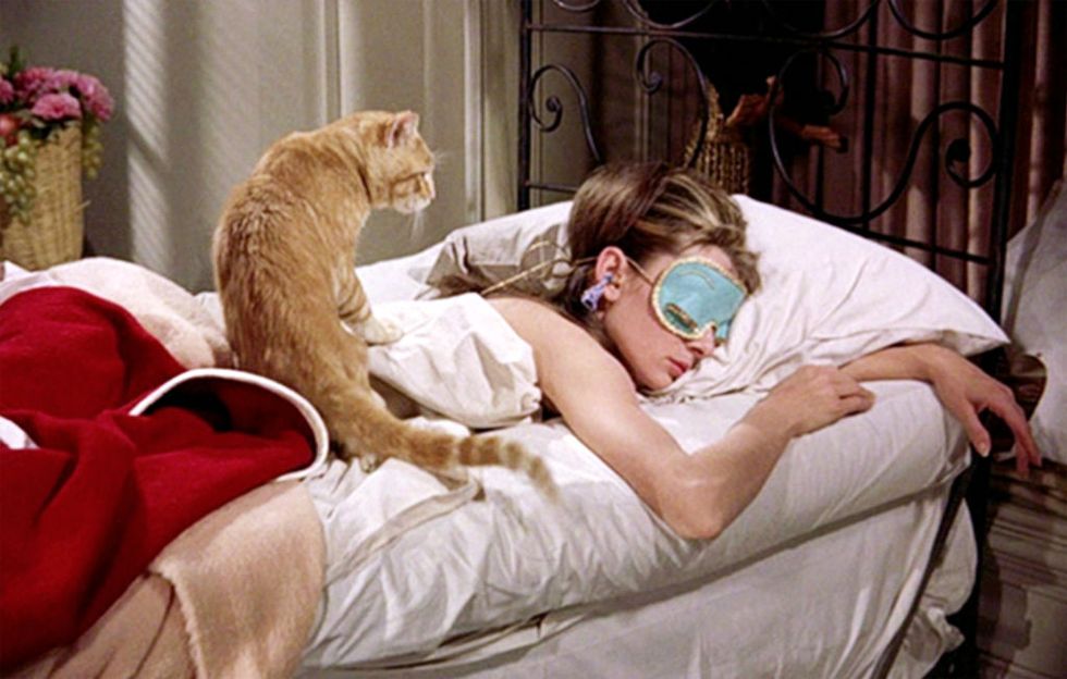 new york october 5 the movie breakfast at tiffanys, directed by blake edwards and based on the novel by truman capote seen here, audrey hepburn as holly golightly and cat initial theatrical release october 5, 1961 screen capture paramount pictures photo by cbs via getty images