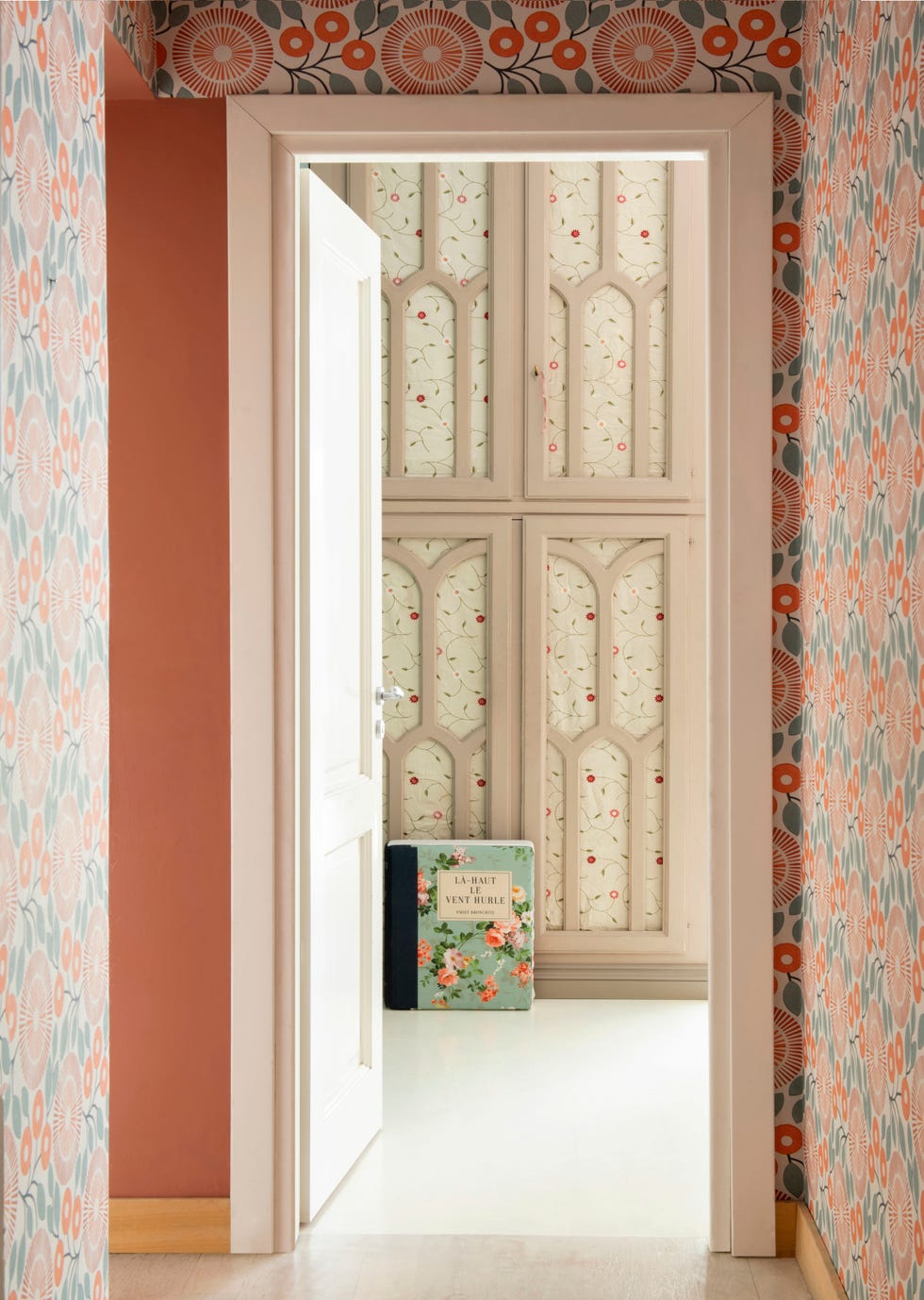 Florals and stripes create a clashing scheme of prints in this home