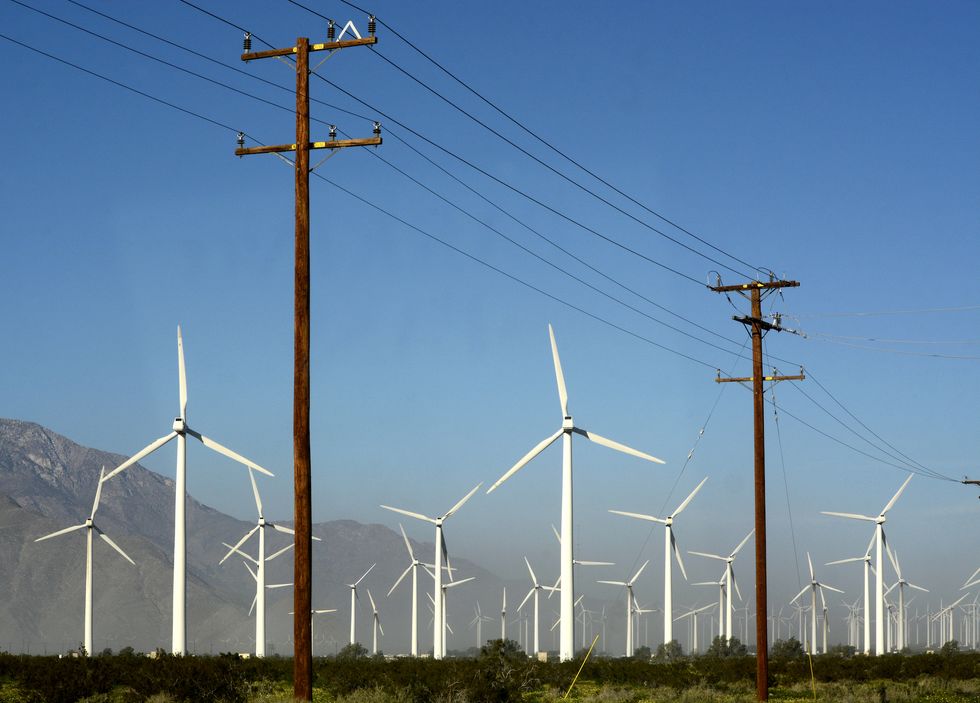 palm springs, california   february 27, 2019 wind turbines located near power poles and transmission lines generate electricity at the san gorgonio pass wind farm near palm springs, california located in the windy gap between southern california's two highest mountains, the facility is one of three major wind farms in california photo by robert alexandergetty images