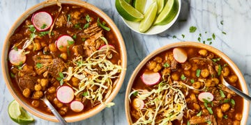 pozole with pork shoulder topped with cabbage and radishes