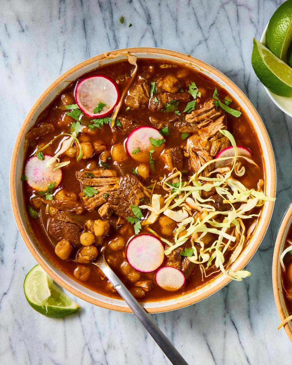 pozole with pork shoulder topped with cabbage and radishes