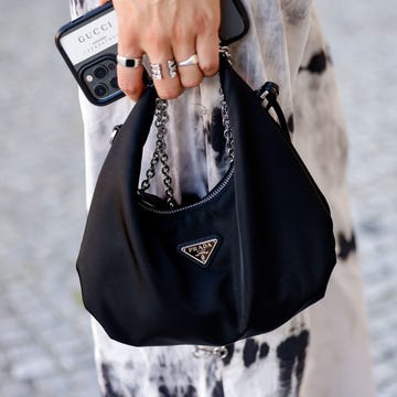 berlin, germany   september 09 a black bag by prada as a detail of influencer jacqueline zelwis, seen at the anja gockel fashion brunch during the mercedes benz fashion week on september 9, 2021 in berlin, germany photo by streetstyleshootersgetty images