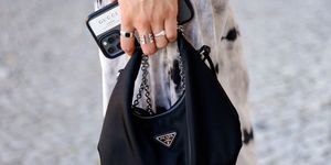 berlin, germany   september 09 a black bag by prada as a detail of influencer jacqueline zelwis, seen at the anja gockel fashion brunch during the mercedes benz fashion week on september 9, 2021 in berlin, germany photo by streetstyleshootersgetty images