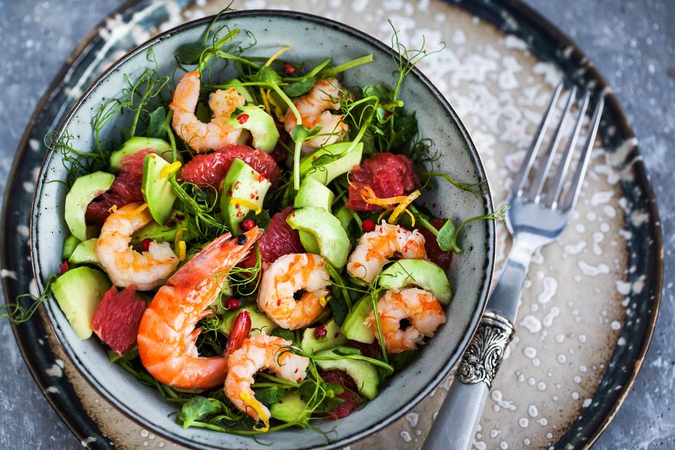 delicious fresh salad with prawns, grapefruit, avocado, cucumber and herbs