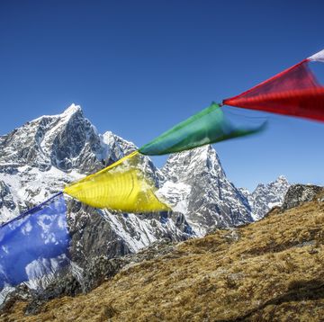 prayer flags in the wind along the trail to everest base camp, nepal