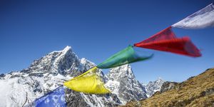 prayer flags in the wind along the trail to everest base camp, nepal