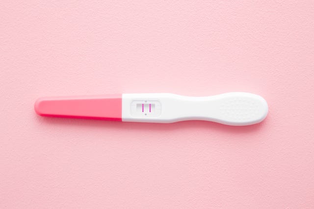 https://hips.hearstapps.com/hmg-prod/images/pregnancy-test-with-two-stripes-on-pastel-pink-royalty-free-image-1606248065.?crop=0.668xw:1.00xh;0.0425xw,0&resize=640:*