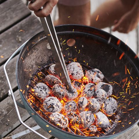 preparing charcoal in grill