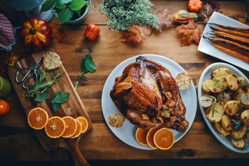 preparing stuffed turkey for holidays in domestic kitchen